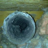 Lint collected in and around a dryer vent.