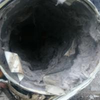 Lint coating the inside of a dryer vent line.
